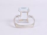 an image of a ring with a blue topazt stone in it