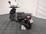 a scooter that is parked in a room