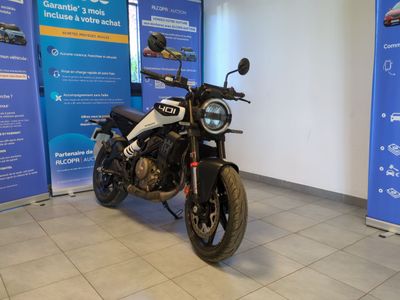 a motorcycle that is parked in a showroom