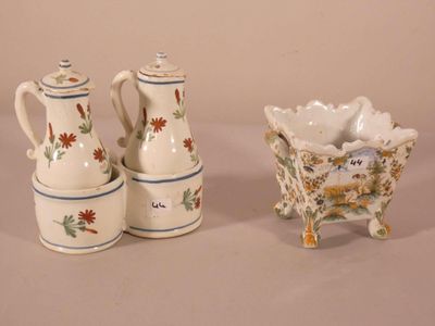 three pieces of pottery sitting on a table