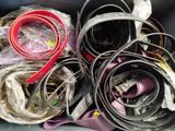 a lot of different types of belts in a bin