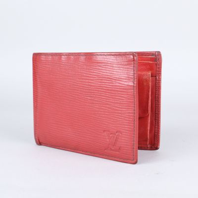 a close up of a red wallet on a white background