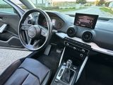 the interior of a car with a steering wheel, dashboard, and dashboard controls