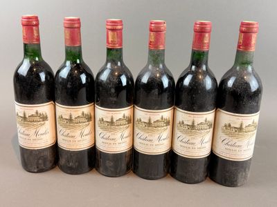 six bottles of wine are lined up in a row on a table