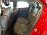 a red car with a black seat belt in the back of it