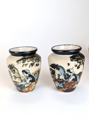 three vases sitting next to each other on a white surface