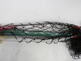 a fishing net and a pair of scissors on a table