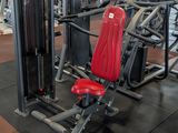 a gym with a lot of machines in the room