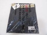 an image of a black shirt with a tag on the front of it