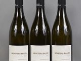 three bottles of wine sitting on top of a table next to each other