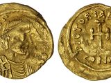 une pièce d'or portant l'image d'un homme