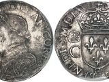 a close up of a coin with a crown on top of it