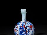 an image of a blue and white vase on a black surface