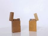 two lighters sitting next to each other on a table