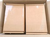 two boxes that are sitting in a box on a table