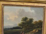 an oil painting of a landscape with a man and a dog by a river