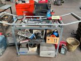 a workbench with a lot of tools on top of it