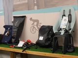 many different types of bags on a shelf in a room
