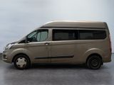 a brown van that is parked in a parking lot