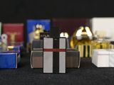 many different types of perfume bottles lined up on a table