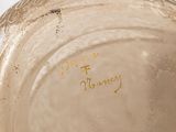 a close up of a vase with writing on it