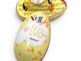 an egg shaped box with a watch inside of it