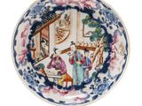 an image of a blue and white plate with a painting on it