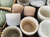 many bowls and cups sitting on a wooden table