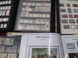 a lot of stamps on a table with a book