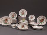 a lot of plates and bowls that are sitting on a table