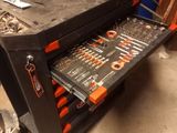 a workbench with tools on it in a garage