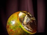 an image of a close up of a glass ball on a table