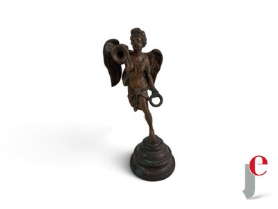 statue of an angel holding a trumpet on a white background
