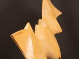 an image of a wooden sculpture on a wooden table