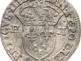 Gros plan sur une pièce de monnaie ornée d'une couronne