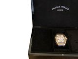 a box with a watch inside of it on a white background