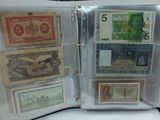five different types of paper money in a binder