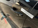 a sticker on the door of a car that says arratto