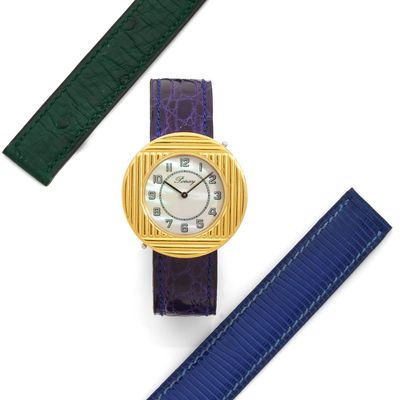 an image of a close up of a wrist watch on a white surface