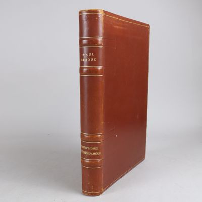 a brown book sitting on top of a white table