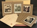 six framed photographs of old buildings in a box on a table
