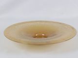 a glass bowl that is sitting on a white surface