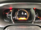 the dashboard of a car with a clock on it ' s dashboard