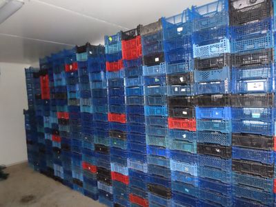 many crates stacked on top of each other in a room