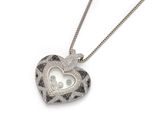 a close up of a heart shaped locke on a chain