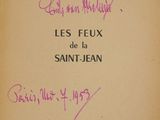 an old book with writing on it with a picture of a cat