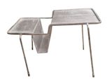 an image of a metal table with a magazine holder on it