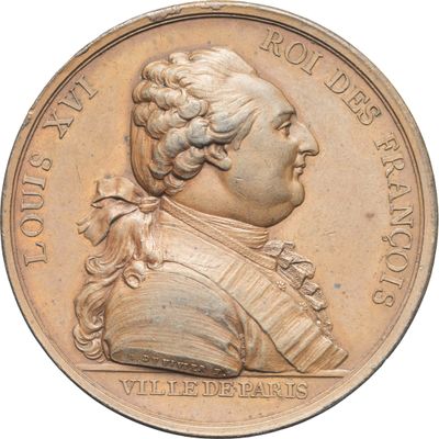 une image montrant un gros plan d'une médaille sur fond blanc