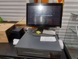 a computer sitting on top of a desk next to a box