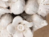 a vase with a bunch of white flowers in it